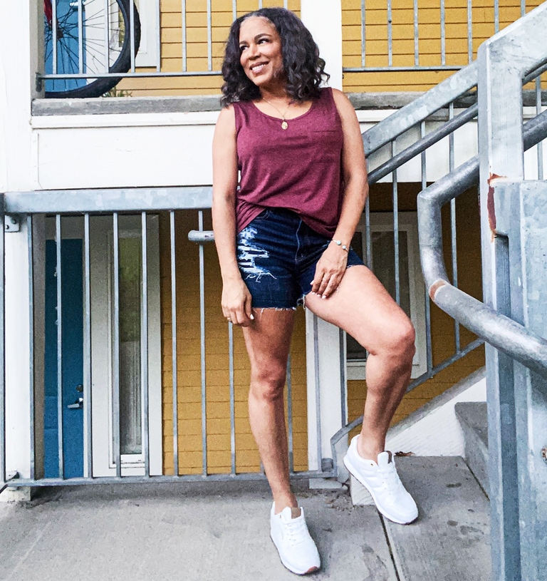 wine color tunic tank top and denim shorts