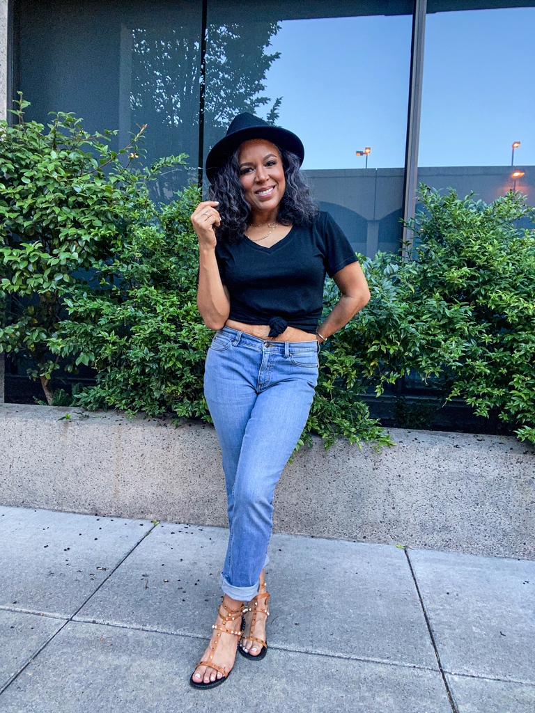 black v-neck tee and jeans and hat